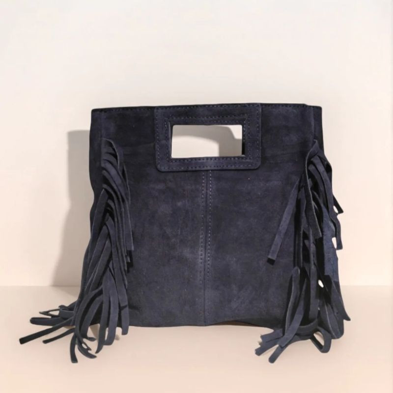 Sac porté main en daim muni d'une bandoulière Sac porté main en daim muni d'une bandoulière