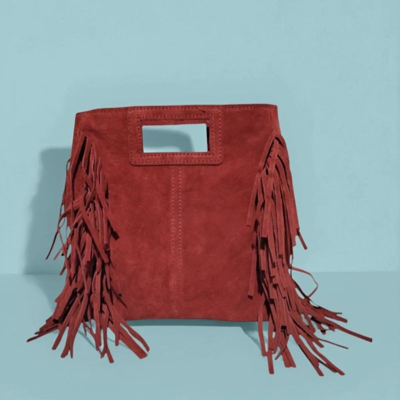 Sac porté main en daim muni d'une bandoulière Sac porté main en daim muni d'une bandoulière